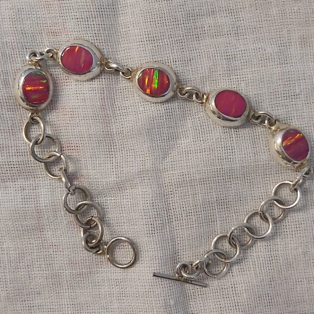 Silver bracelet with pink stones